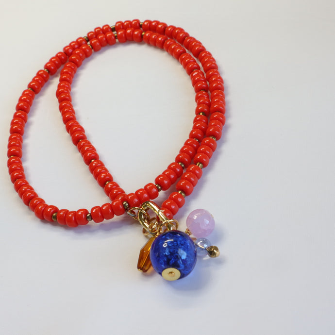 Orange beaded charm necklace