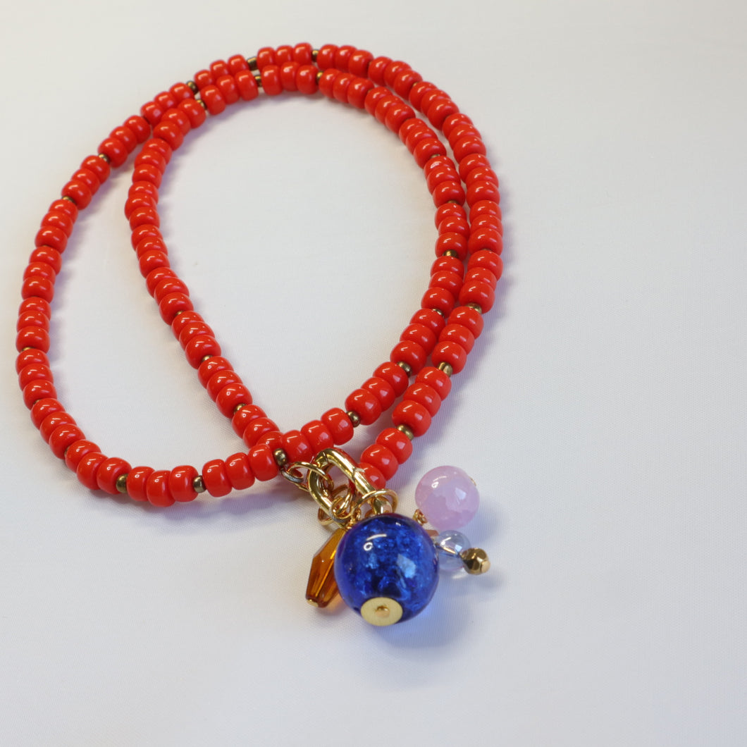 Orange beaded charm necklace
