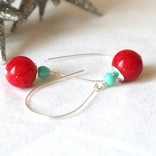 Load image into Gallery viewer, A pair of silver earrings featuring red and blue gemstones, on a white background.