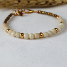 Load image into Gallery viewer, Cream and bronze beaded bracelet 