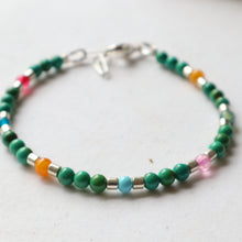 Load image into Gallery viewer, Multicolored beaded bracelet on a light background
