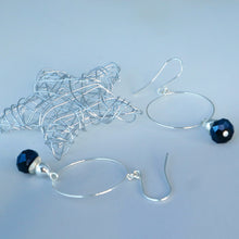 Load image into Gallery viewer, Silver wire earrings with blue beads on a light gray background