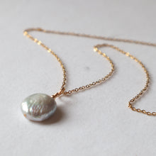 Load image into Gallery viewer, Pearl necklace on a gold chain against a light background