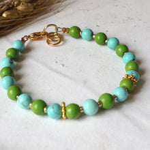 Load image into Gallery viewer, Green and turquoise bracelet on a white background 
