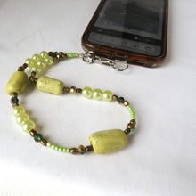 Load image into Gallery viewer, Beaded phone lanyard with green stones on a white surface
