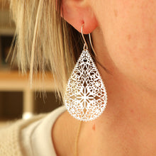Load image into Gallery viewer, Silver teardrop earrings on a model