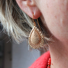 Load image into Gallery viewer, Model wearing gold filigree earrings 