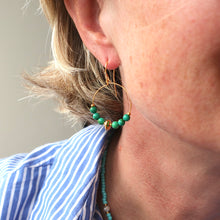 Load image into Gallery viewer, model wearing green hoop earrings